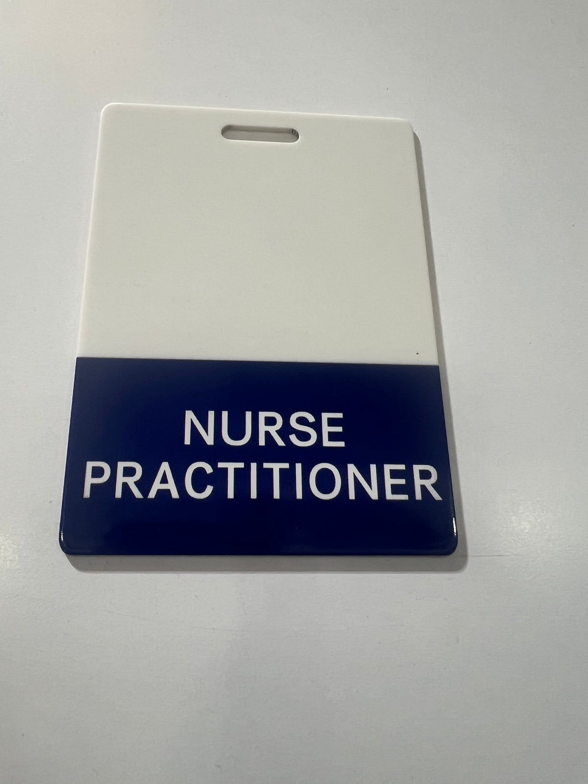 Nurse Practitioner’s (NP)Pink, Purple and Blue Role Recognition ID badge.